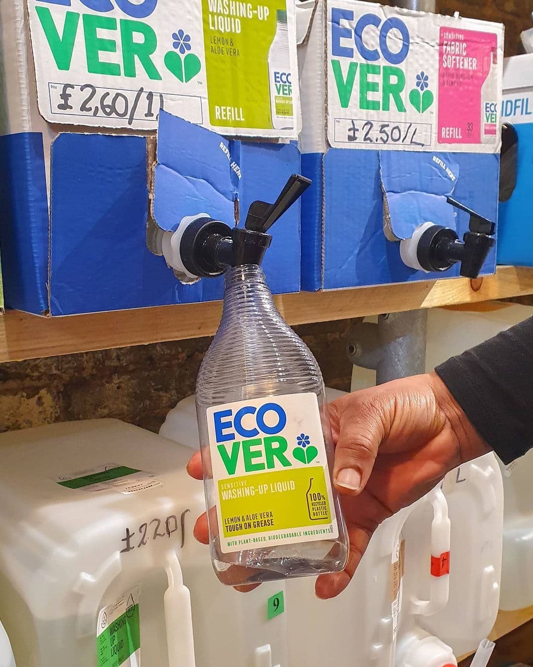 Picture of an empty bottle being refilled